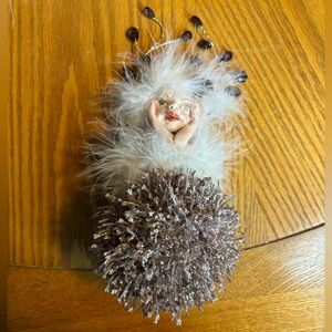 Unique Feathered Fairy figure on glitter ball